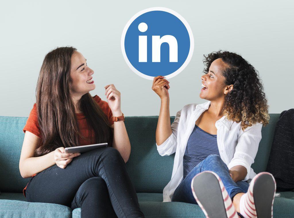 women holding a linkedin logo scaled